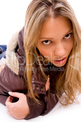 front view of laying young woman looking at camera