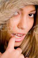 close up of young woman with winter coat