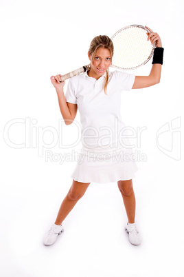 front view of standing tennis player holding racket