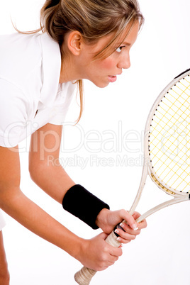 side view of tennis player with racket