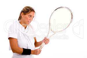 side view of woman playing tennis