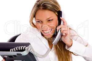 portrait of smiling businesswoman busy on phone