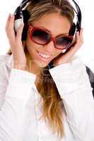 portrait of smiling female listening music