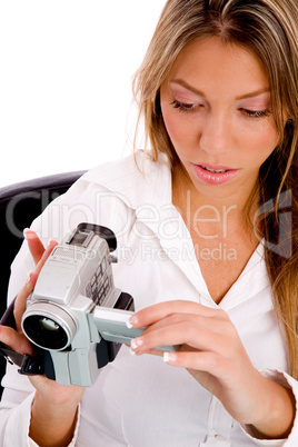 top view of businesswoman holding handy cam