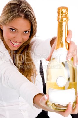 top view of businesswoman showing champagne bottle