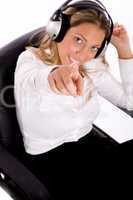 top view of businesswoman listening music