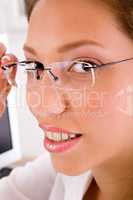 close up of businesswoman holding eyewear