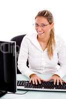front view of smiling manager working on computer