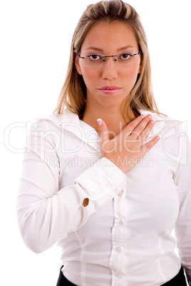 front view of businesswoman keeping hand on her chest