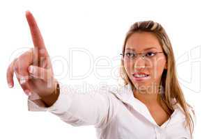 portrait of businesswoman pointing up