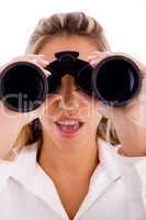 close view of young businesswoman looking through binocular