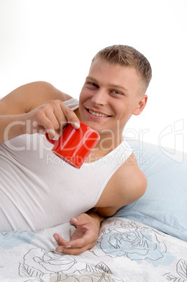 smiling handsome man having coffee mug