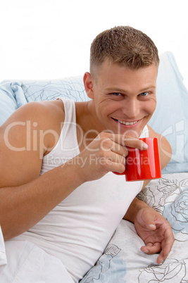 smiling male having coffee mug