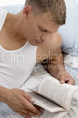 handsome male reading book