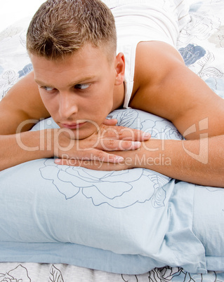 young man relaxing in bed