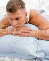 young man relaxing in bed