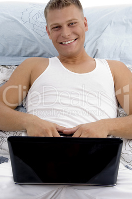 smiling guy posing with notebook