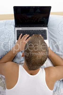 high angle view of man working on laptop