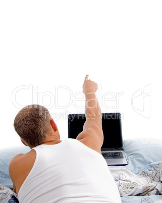 laying indicating man with laptop
