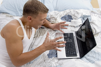 white man working on laptop