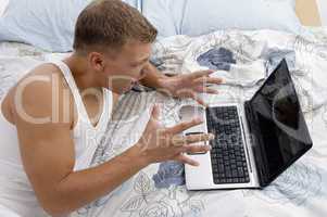 white man working on laptop