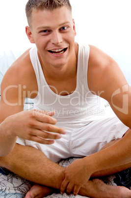 portrait of smiling man in bed