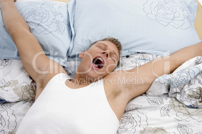 yawning man stretching his arms