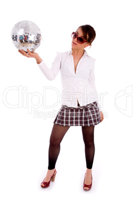 full body pose of attractive female holding disco ball