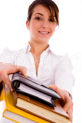 front view of cheerful woman holding text books