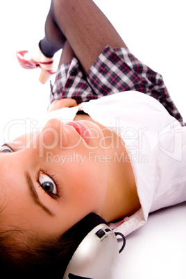 side pose of woman on floor listening to music