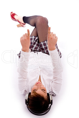 high angle view of pointing woman lying down on floor
