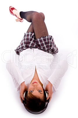high angle view of woman on floor listening music