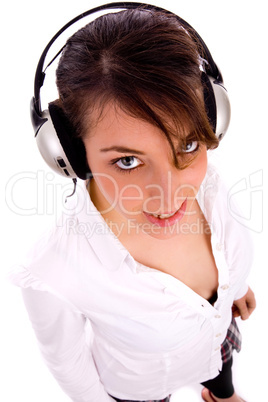 high angle view of happy fashionable woman listening music