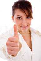 front view of smiling woman with thumbs up