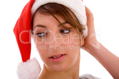 front view of female looking sideways wearing christmas hat