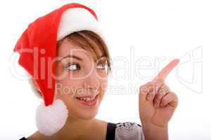 front view of pointing woman in christmas hat
