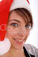 front view of smiling woman wearing christmas hat
