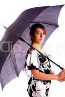 side pose of young woman holding an umbrella