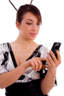 front view of smiling woman using cell phone