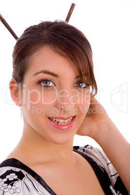 front view of smiling Japanese woman with hair sticks