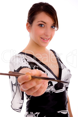 front view of smiling japneese woman holding chopsticks