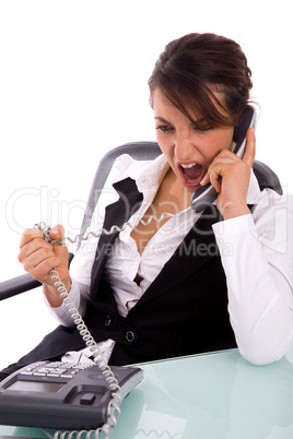 front view of angry executive interacting on phone