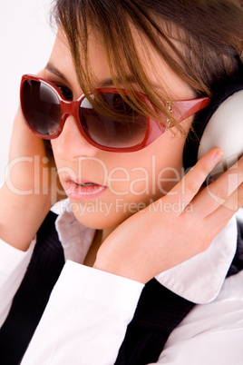 side view of fashionable woman listening to music