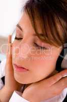 side view of female professional listening to music