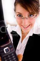 front view of smiling businesswoman showing her cellphone