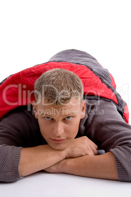 young man covered himself with red sleeping bag