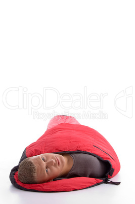 young man covered himself with red sleeping bag