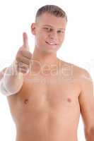 smiling muscular man showing approval sign