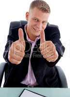smiling businessman showing approval sign with both hands