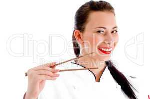 female chef holding chopsticks